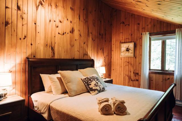 The king bedroom with dark wood bed