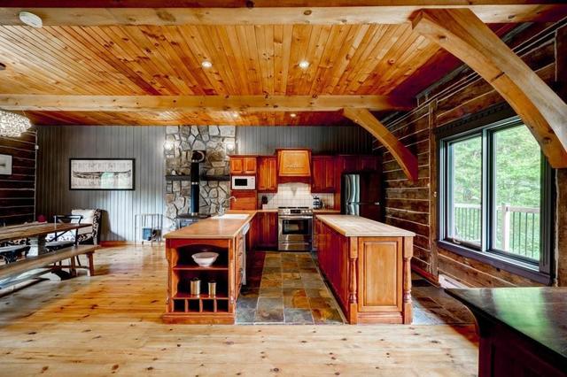The kitchen island and range under the beams