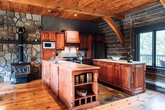 Kitchen with the stone fireplace in the background