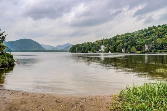 Calm lake with hills beyond