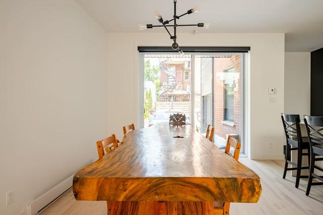 Live-edge wood dining table by the window