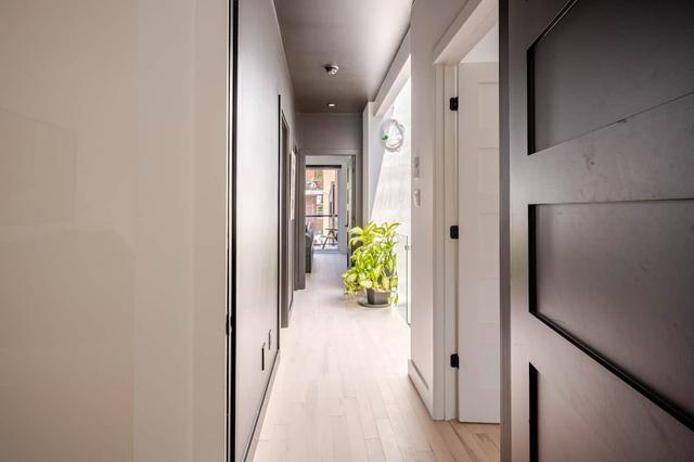 Upstairs hallway with black doors