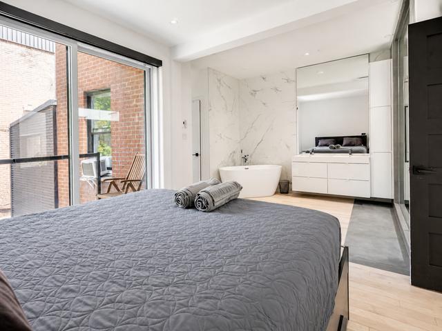 The king bedroom with sliding door to the balcony