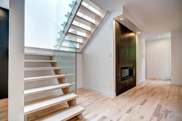 The staircase beside the fireplace wall