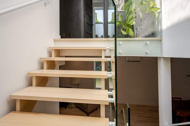 Floating maple stairs with glass railing