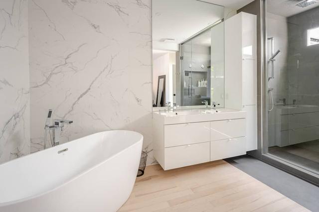 Freestanding tub beside the white vanity